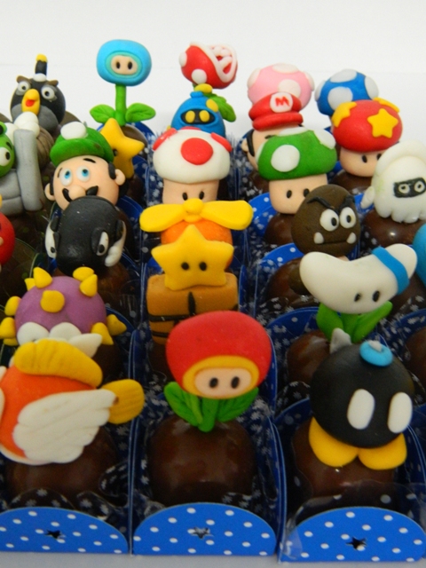 a display in a box of toy figurines of mario and other characters