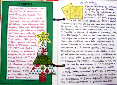 a paper christmas tree inside a notebook with an empty page