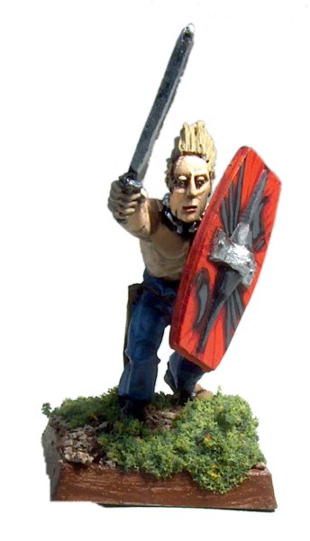 a toy figurine is holding a large sword and shield