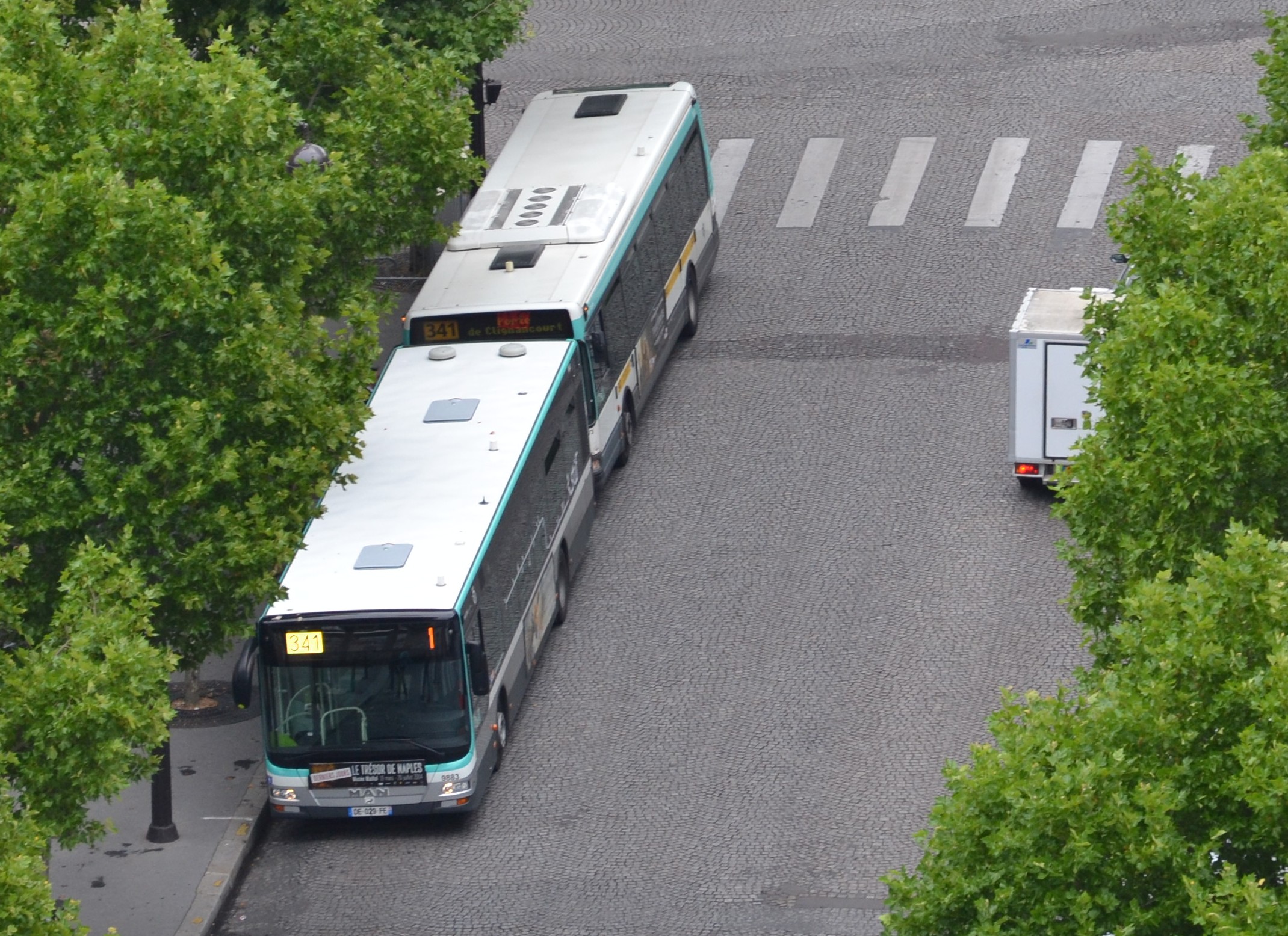 a large bus traveling down a curvy road