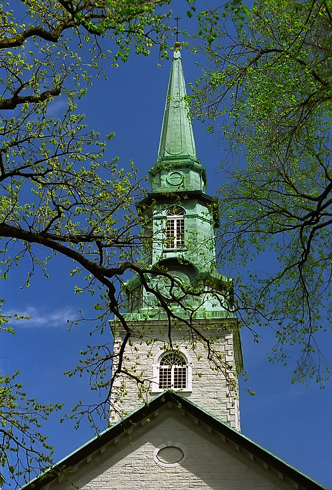 a church steeple with a clock on top