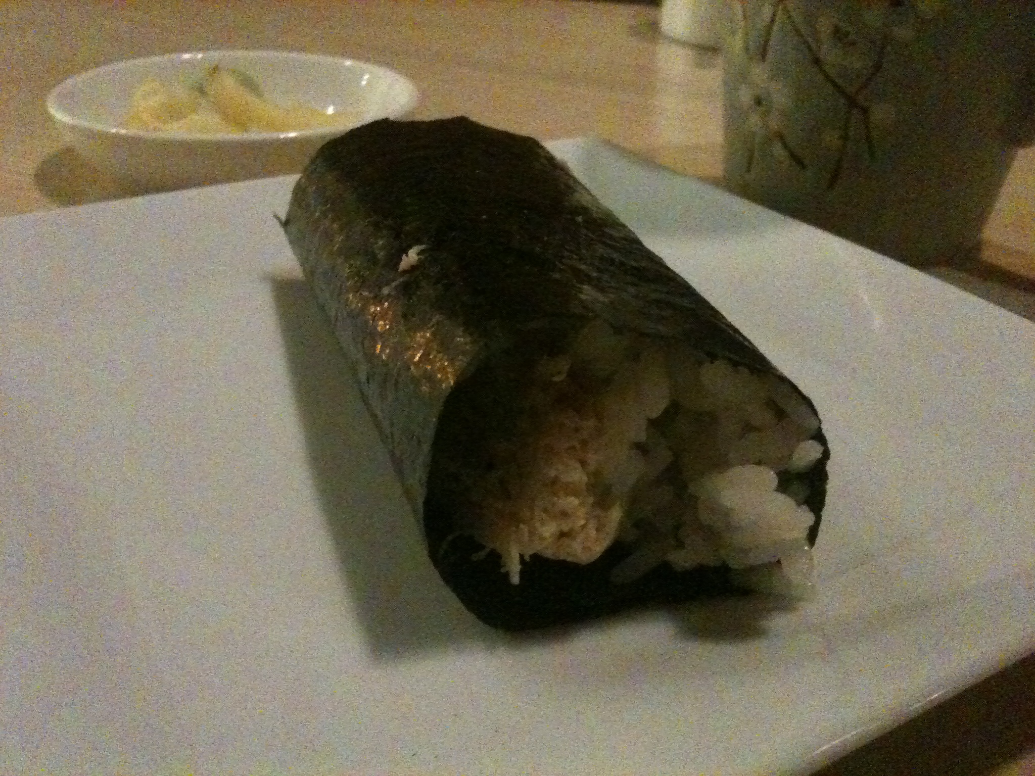 a sushi with seaweed is on a plate