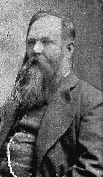 an old black and white pograph of a man with long beard