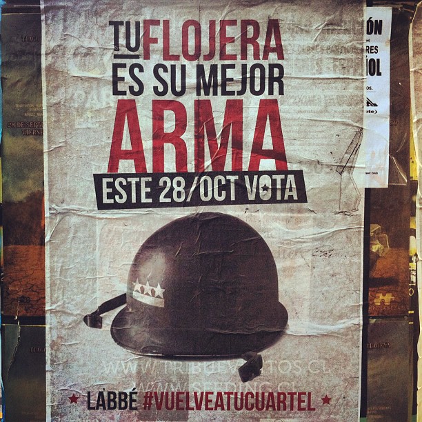 a poster on the street that is advertising an army helmet