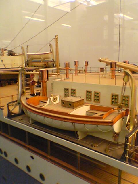 there is a large boat in the glass case
