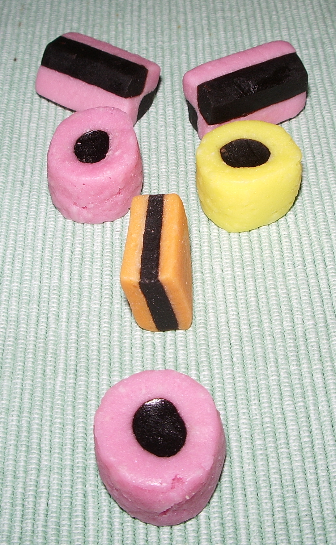 a variety of desserts arranged in the shape of a car