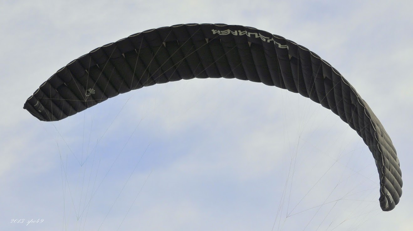 an image of someone that is parachute surfing in the air
