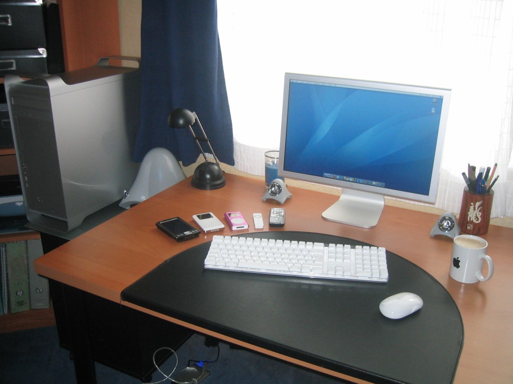 a computer desk is set up in a corner