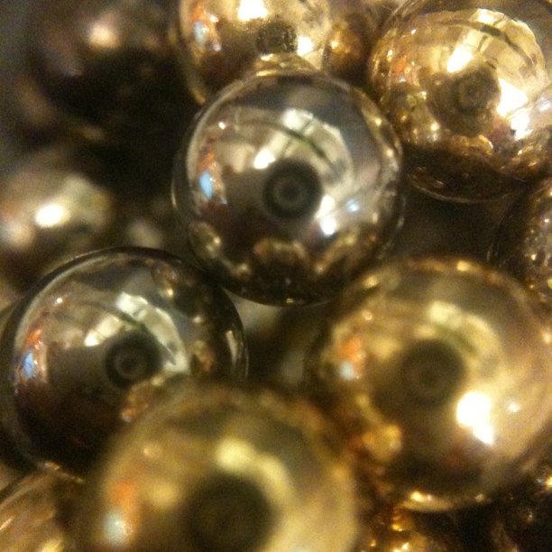 some very shiny shiny looking metallic beads