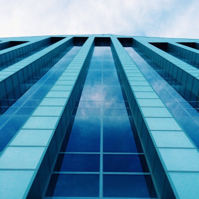 a skyscr tower against a clear blue sky