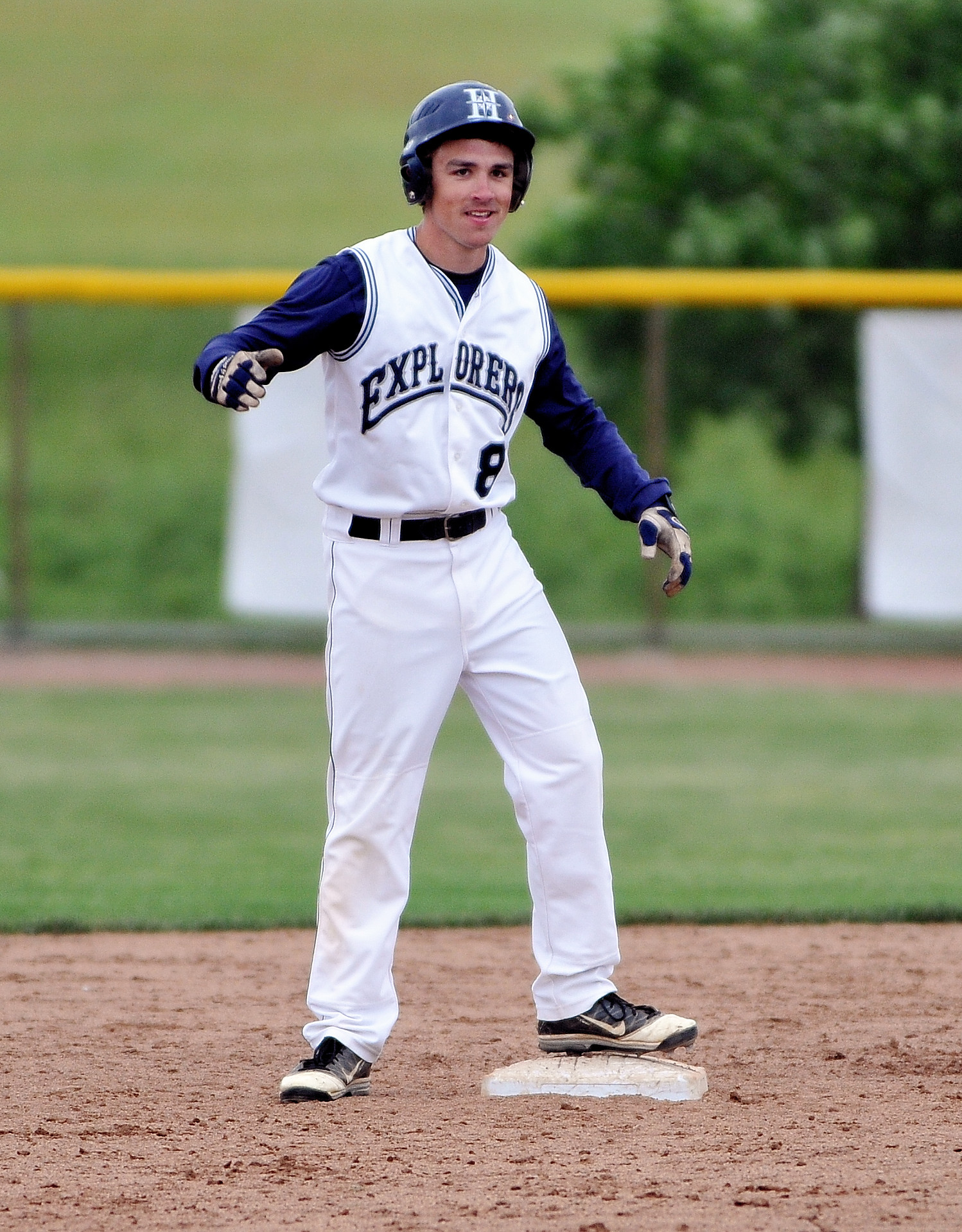 a baseball player who is warming up to run