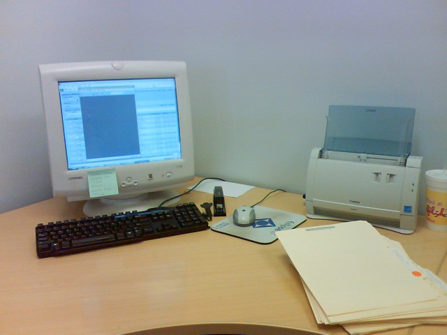 a desktop computer sits on top of a desk