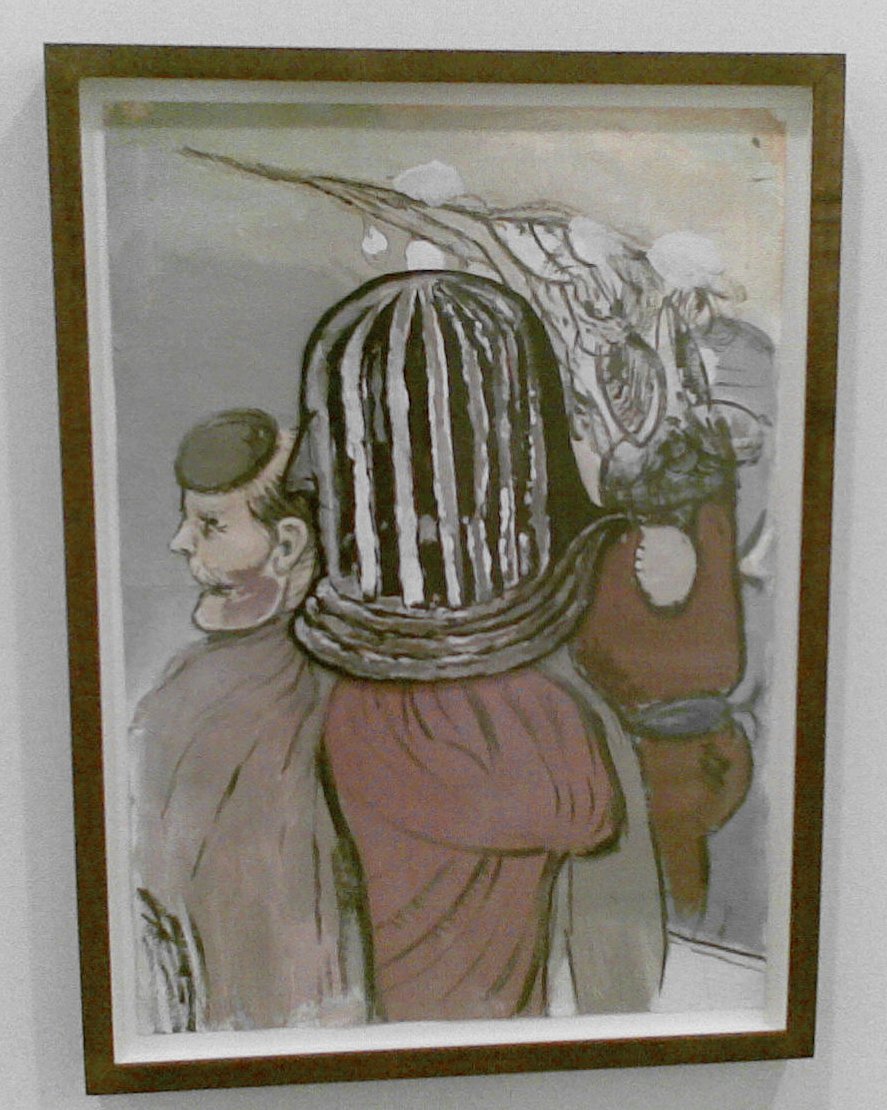 an artwork hanging up against a white wall