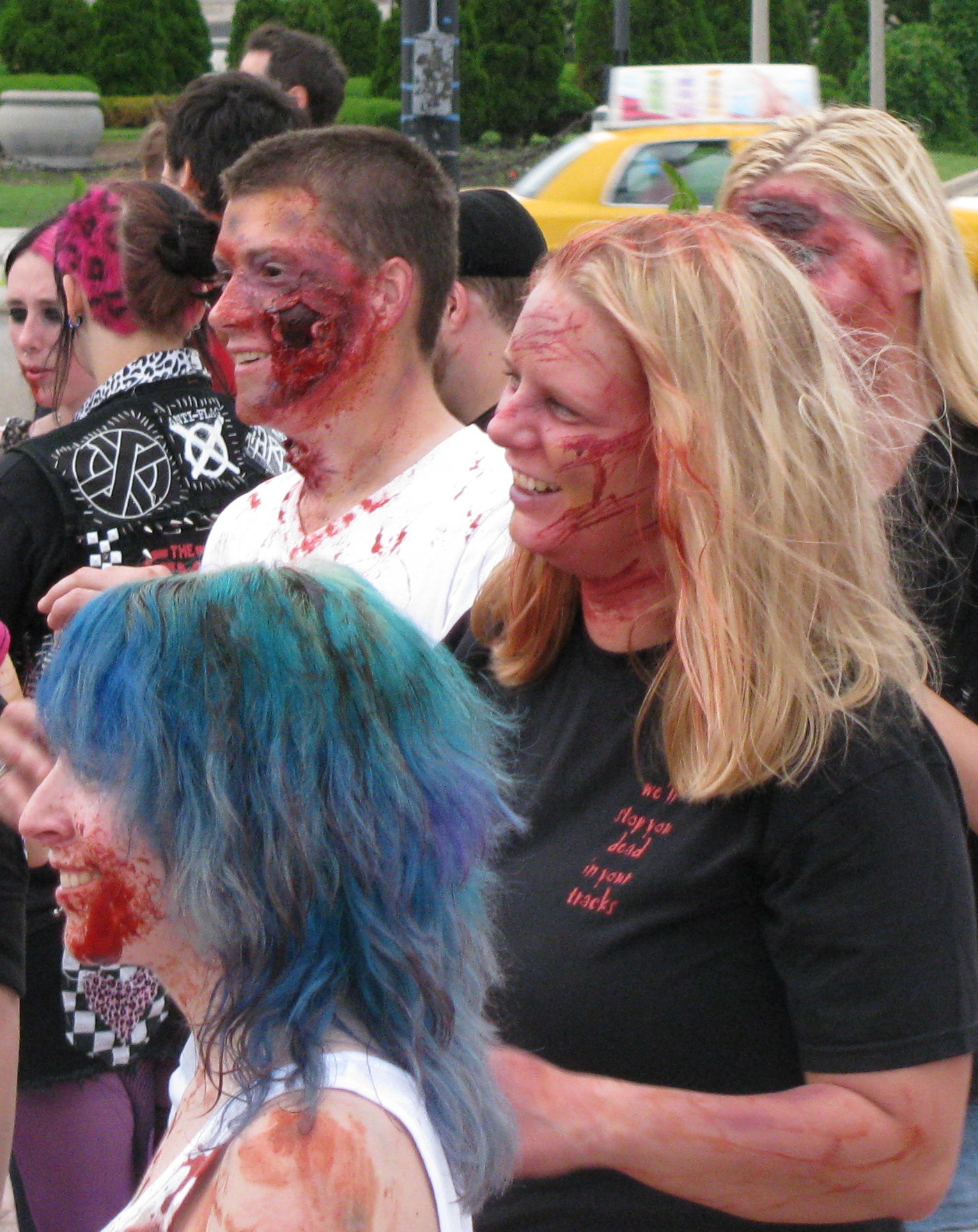 group of people all dressed up with fake body paint on their face