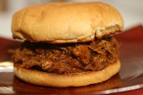 a close up of a hamburger on a plate