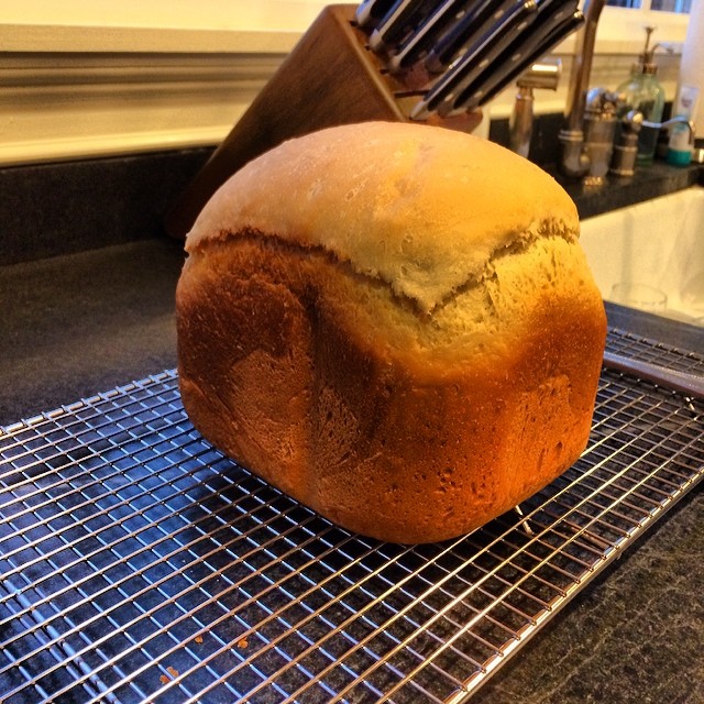 a loaf of bread sitting on top of a cooling rack