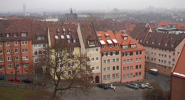 an overview of old brick buildings on a city street