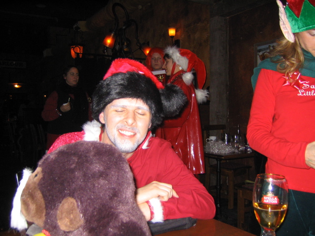 a man dressed as santa claus at a christmas party