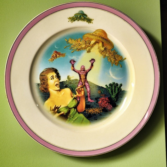 a close up of a plate with a painting on it