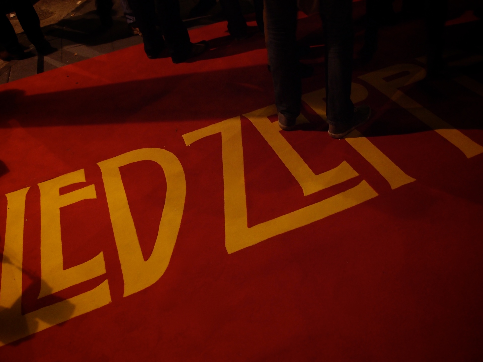 the words'weditzl'painted on the carpet of a red carpet