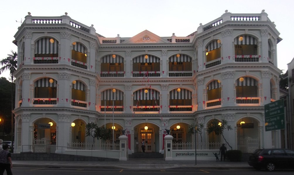 an ornate building with lots of windows and balconies at night