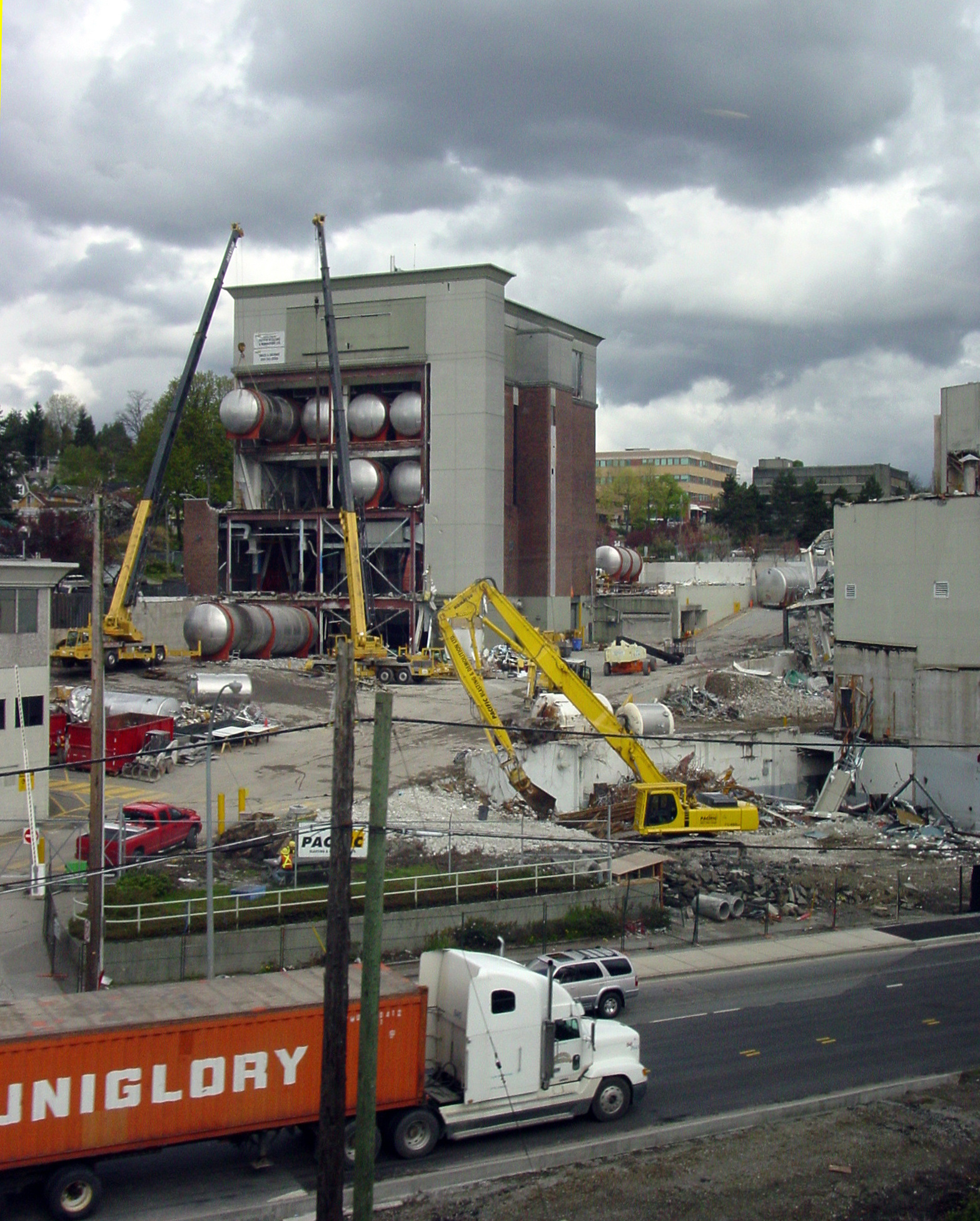 a large construction truck driving through the dirt