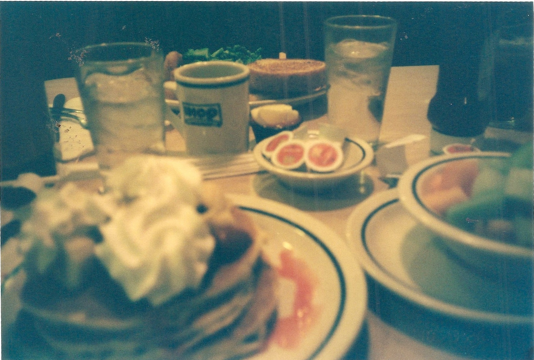 a table topped with plates filled with food