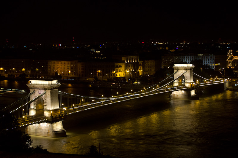 a large bridge with illuminated lights on the top