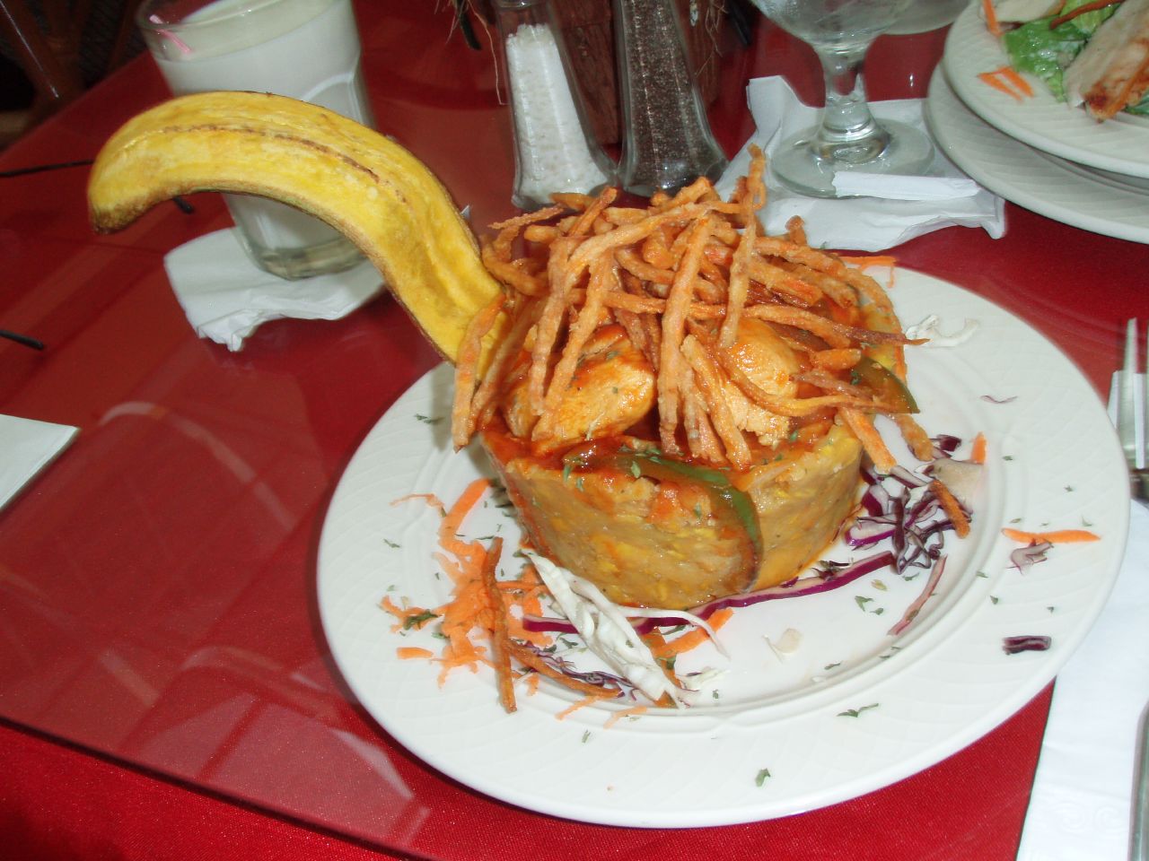 a plate with french fries and fruit on it