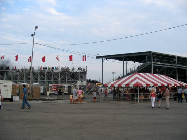 a large tent on the side of a baseball field