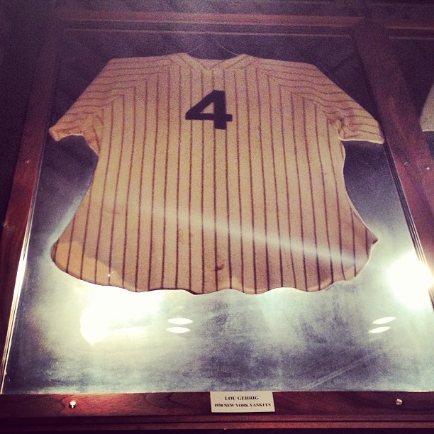 a vintage baseball jersey displayed in a frame