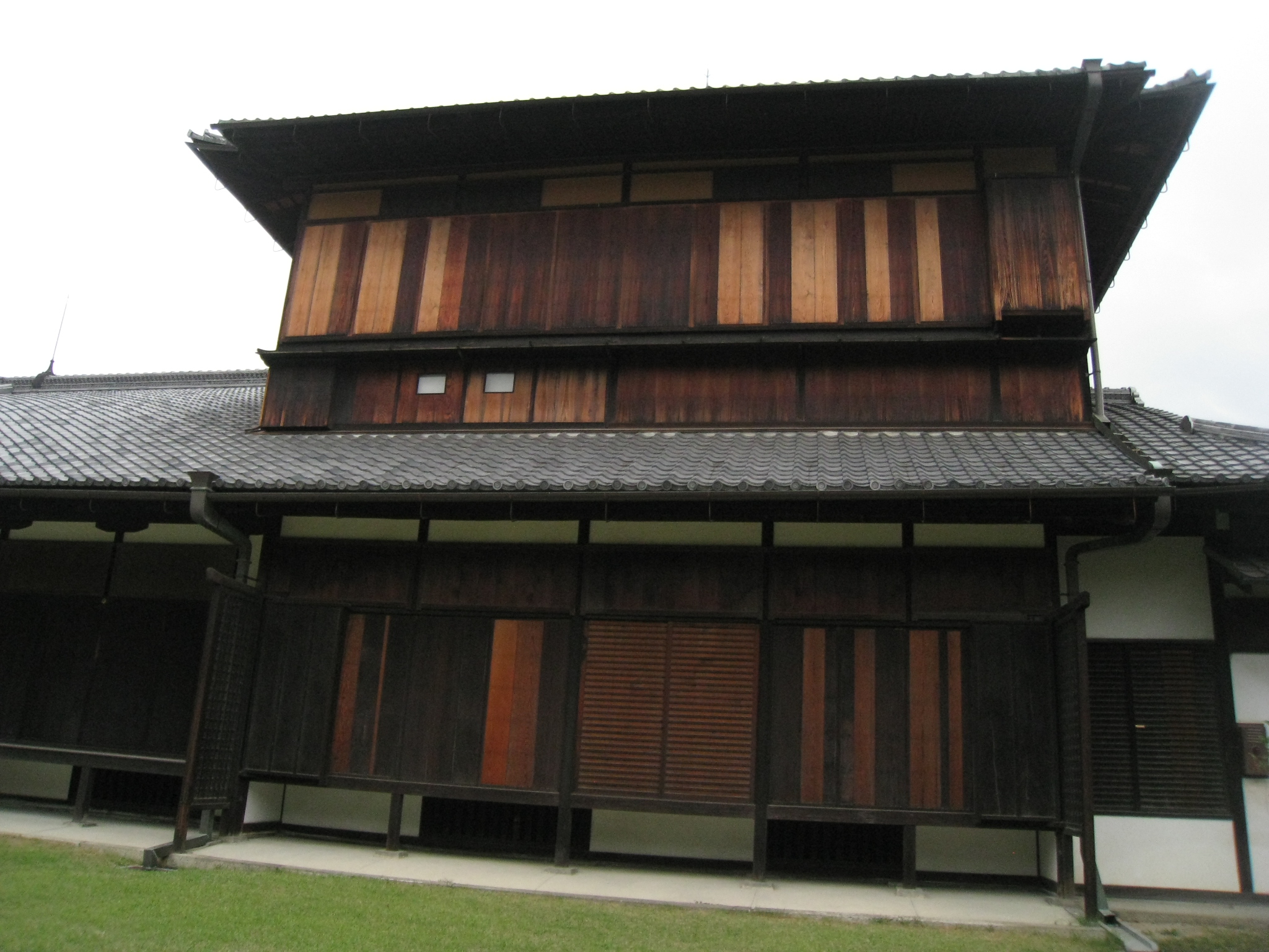 a building with large windows and a wooden roof