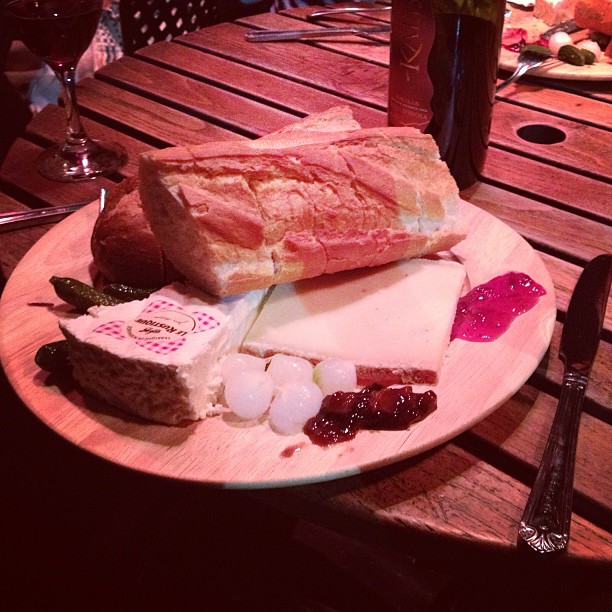 a white plate with different kinds of cheeses