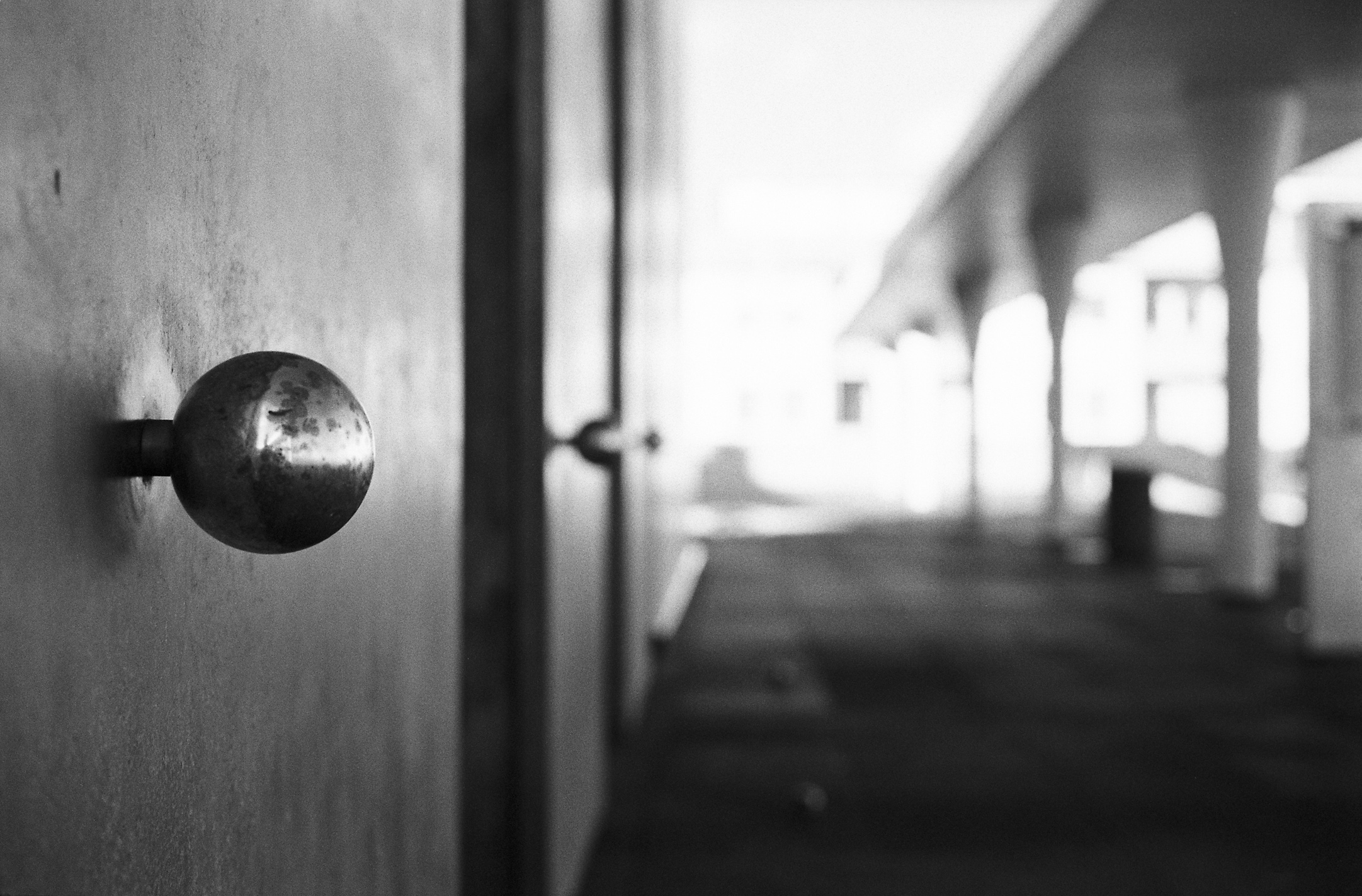 the door handle on a wooden building is shown