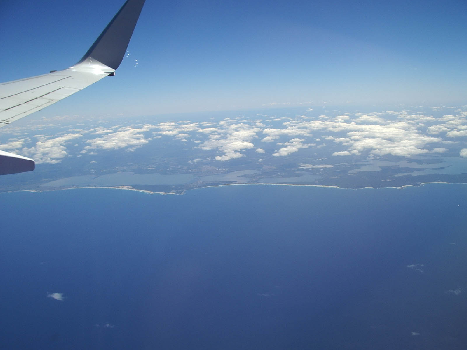 view from a jet flying over the ocean