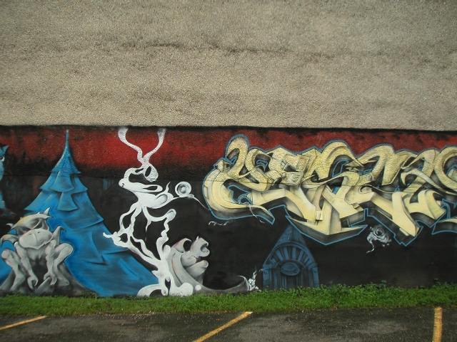 a wall with some graffiti on it