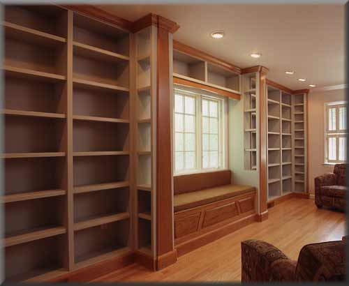 empty wood bookcases in a very big room