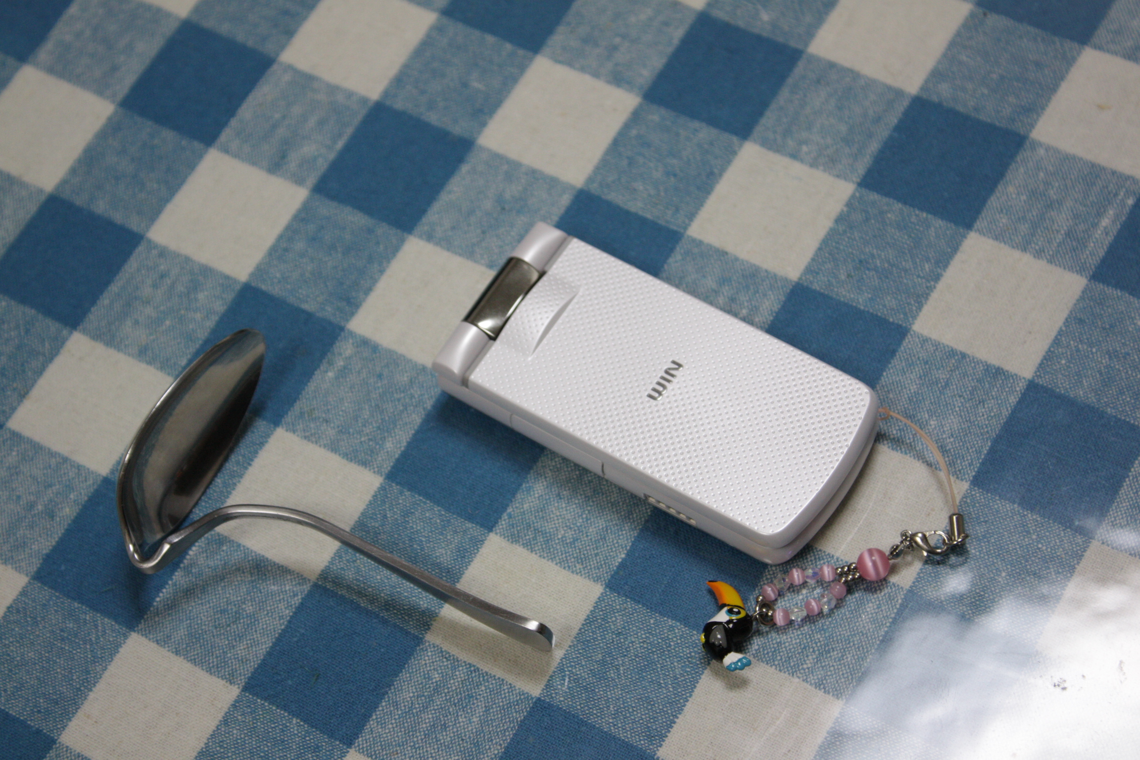 some sort of electronic device sitting on a blue tablecloth