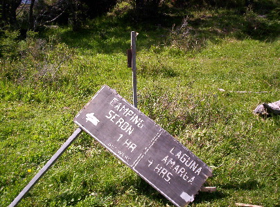 a wooden sign laying on the ground
