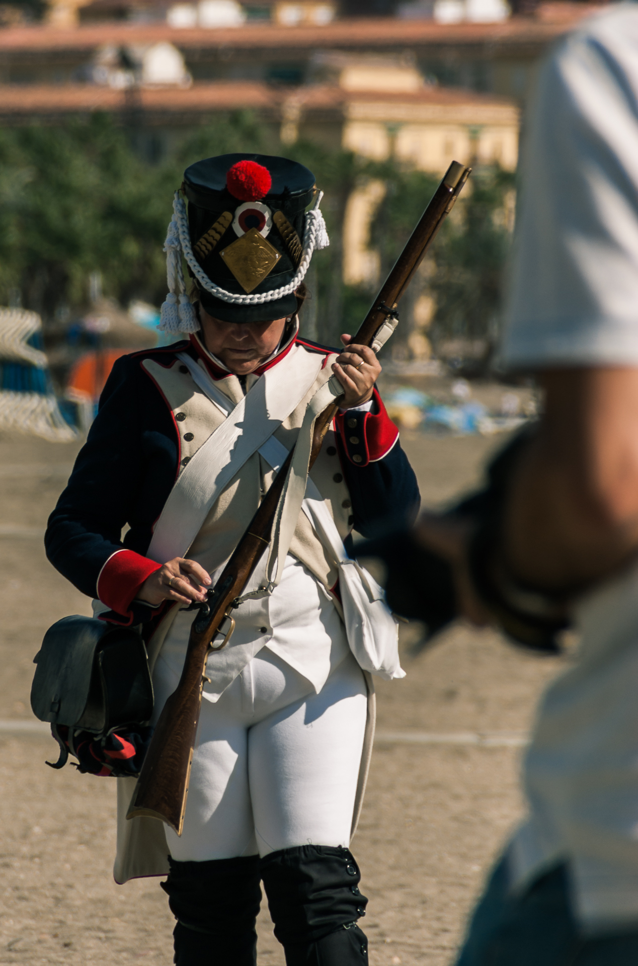a person in uniform holding onto a rifle and sgun