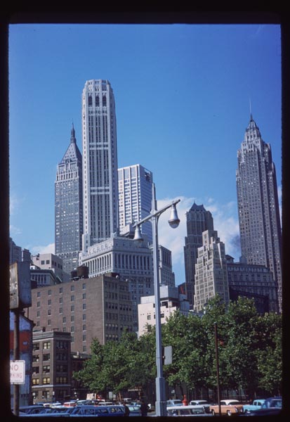 several tall buildings standing behind a city skyline