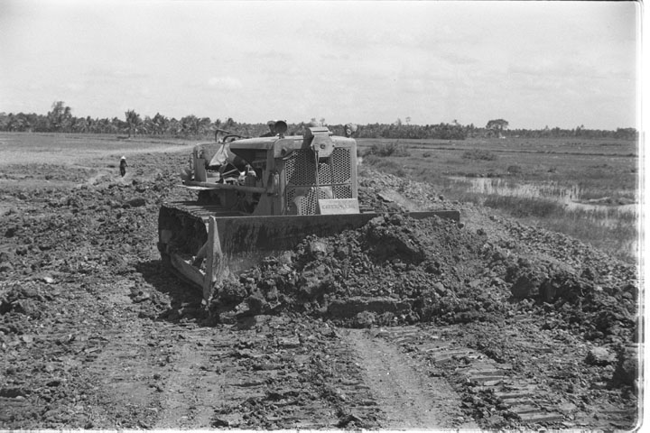 a tractor parked on the side of a road