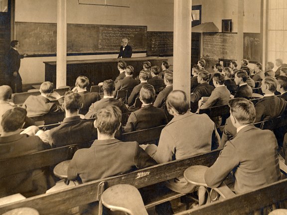 a school class with lots of people attending a lecture