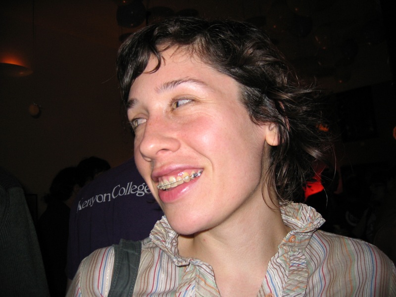 a woman wearing a shirt smiles into the camera