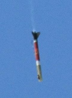 a rocket is in the air and being launched