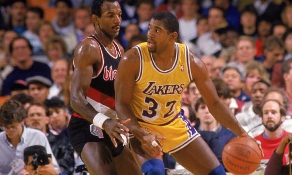 two basketball players are shown holding a ball