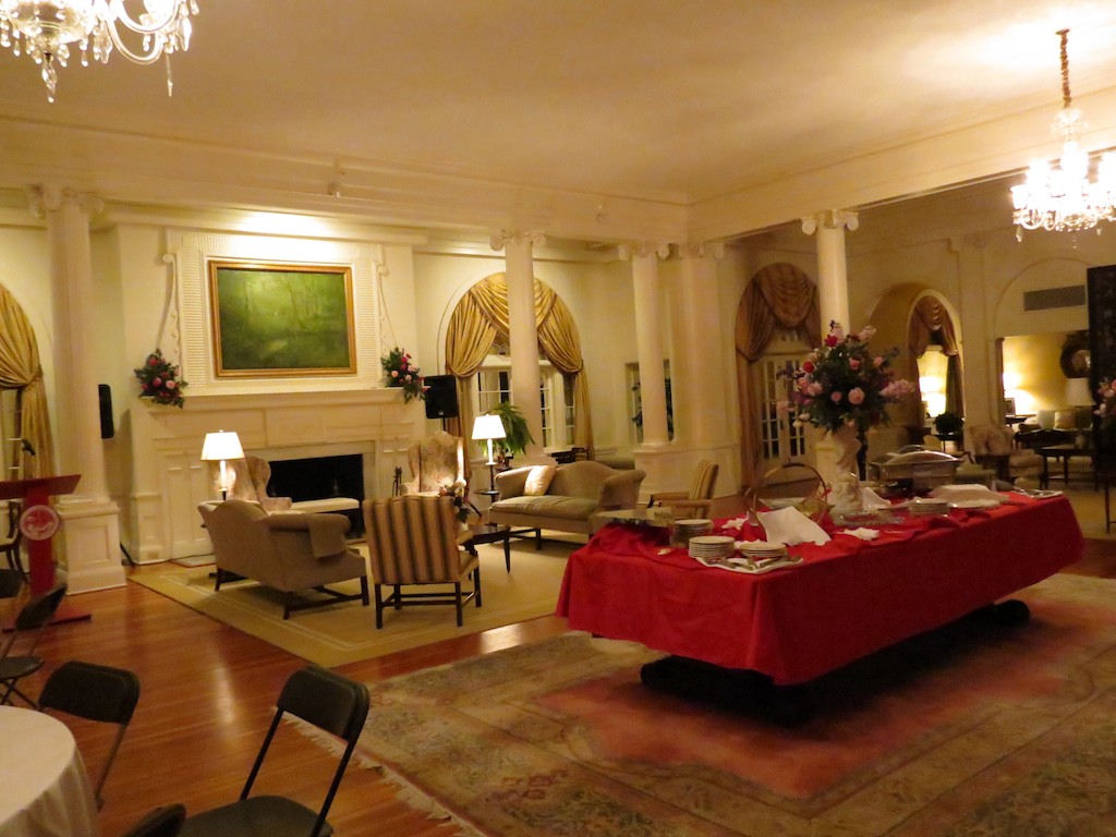 an elegant white el lobby with red cloth