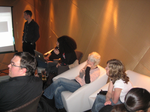 a group of people sitting in an empty room