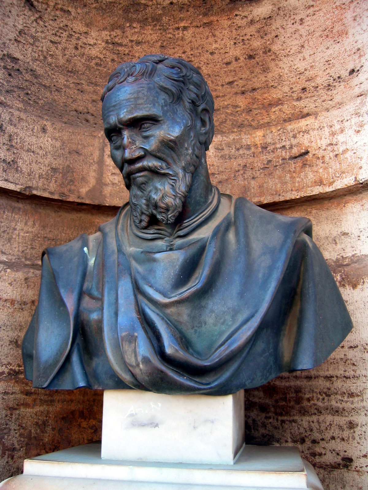 a close up of a bust of a man wearing a blue scarf