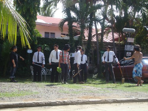 a group of boys dressed in ties and vests